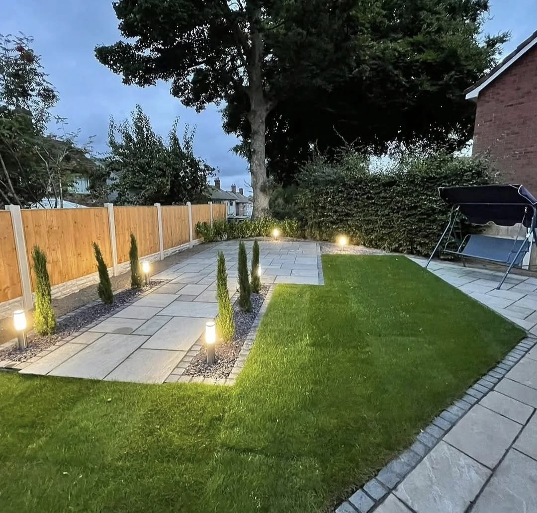 New timber fencing surrounding a paved and planted garden by Rose Gardens