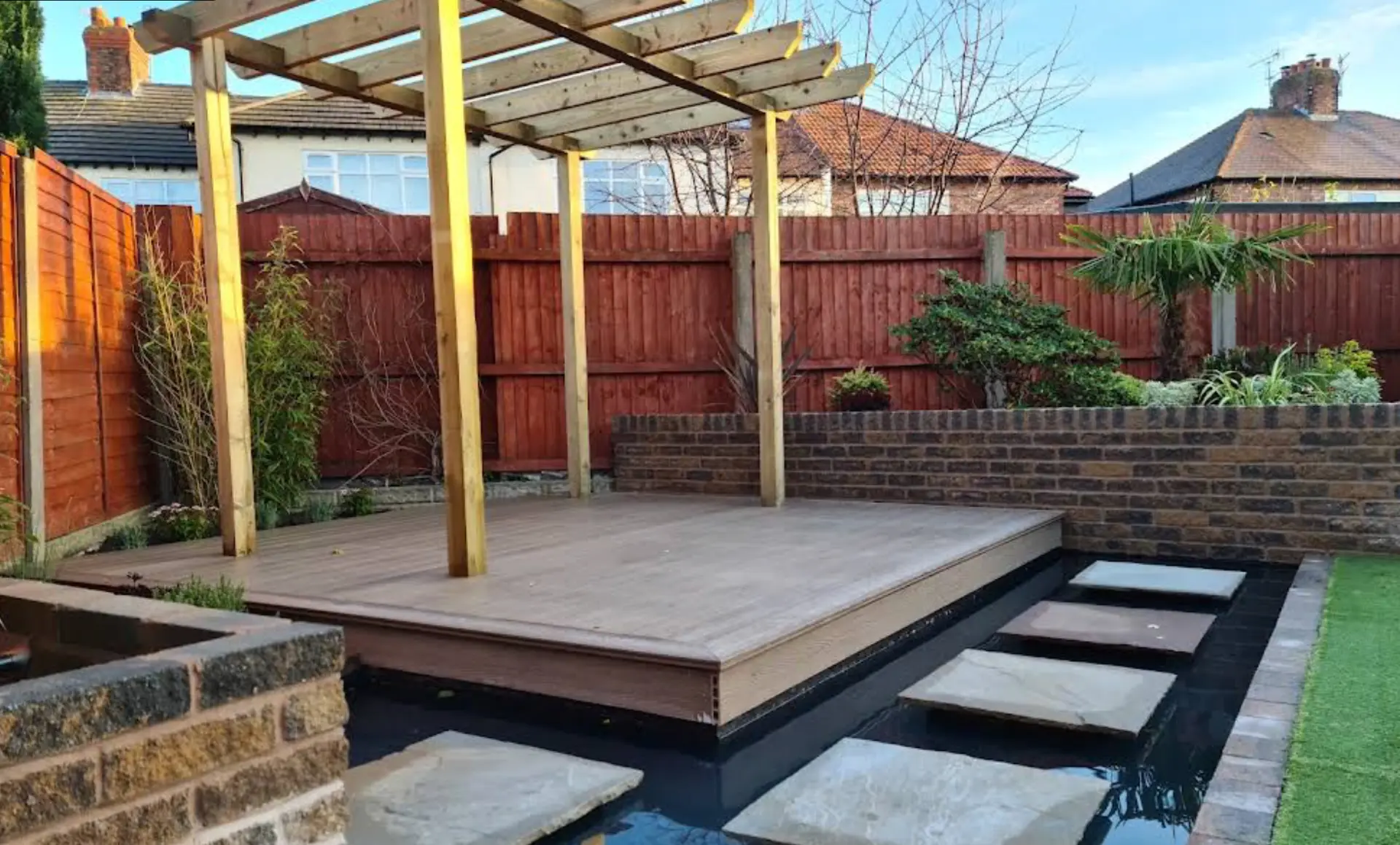 Landscaped garden in Liverpool with timber pergola, paving and water feature